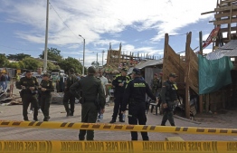 Handout picture released by Colombia's National Police showing police members at the bullring where a grandstand collapsed, in the Colombian municipality of El Espinal, southwest of Bogotá, on June 26, 2022. -- Photo: Handout / Colombian National Police / AFP