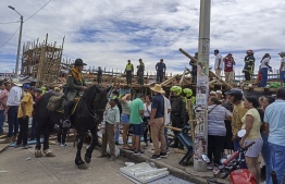 Handout picture released by Colombia's National Police showing police members at the bullring where a grandstand collapsed, in the Colombian municipality of El Espinal, southwest of Bogotá, on June 26, 2022. -- Photo: Handout / Colombian National Police / AFP
