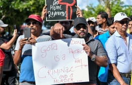 Sri Lankan protesters hold posters calling for Maldivian government not to provide protection for Sri Lankan President Gotobaya Rajapakse on Wednesday July 13, 2022 -- Photo: Nishan Ali / Mihaaru