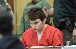 (FILES) In this file photo taken on April 27, 2018, Florida school shooting suspect Nikolas Cruz looks down during a hearing in Fort Lauderdale, Florida. - Cruz has already pleaded guilty to 17 counts of first-degree murder and 17 counts of attempted murder for those wounded at Marjory Stoneman Douglas High School in Florida on Valentine's Day in 2018. The trial is being held to determine his sentence. (Photo by Taimy Alvarez / POOL / AFP)