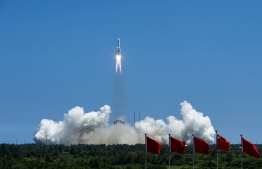 The rocket carrying China’s second module for its Tiangong space station lifts off from Wenchang spaceport in southern China on July 24, 2022. China on July 24 launched the second of three modules needed to complete its new space station, state media reported, the latest step in Beijing's ambitious space programme. -- Photo: AFP