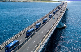 Fleet of mini-buses travel across the Sinamale' Bridge; 12 of these will be put on Male' area operation-- Photo: MTCC