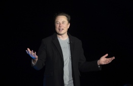(FILES) In this file photo taken on February 10, 2022 Elon Musk gestures as he speaks during a press conference at SpaceX's Starbase facility near Boca Chica Village in South Texas. - The court battle between Elon Musk and Twitter kicked off on July 19, 2022, as the social media firm tries to force the entrepreneur to honor their $44 billion buyout deal. The first hearing will center on Twitter's push to set a trial date for as early as September in a case that has massive stakes for both parties. -- Photo: Jim Watson / AFP