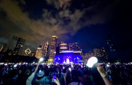 Fans hold up BTS' lighstick named ARMY Bomb as BTS' J-Hope headline the US music festival Lollapalooza on July 31, 2022 in Chicago, US -- Photo: BTS' official Twitter account @bts_bighit