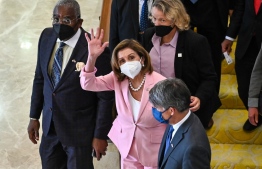 This handout photo taken and released by Malaysia's Department of Information on August 2, 2022, shows Speaker of the US House of Representatives Nancy Pelosi waving as she leaves the Parliament House after a meeting with Malaysian officials in Kuala Lumpur. - US House Speaker Nancy Pelosi arrived in Kuala Lumpur for her second stop in an Asian tour that has sparked rage in Beijing over a possible stop in Taiwan. -- Photo: Nazri Rapaai / Malaysia Department of Information / AFP