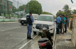 Authorities making an arrest of one of the Kudahuvadhoo protest suspects--