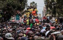 Supporters listen during a rally of Kenya's Deputy President and presidential candidate William Ruto of Kenya Kwanza (Kenya first) political party coalition in Thika, Kenya, on August 3, 2022. -- Photo: Yasuyoshi Chiba / AFP