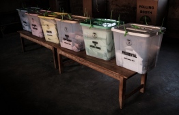 Sealed ballot boxes stand on a table after polls closed during Kenya's general election at the Masurura primary school polling station in Masurura on August 9, 2022. -- Photo: Yasuyoshi Chiba / AFP