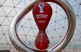 A partial view shows the Qatar 2022 FIFA World Cup countdown clock in Doha on August 10, 2022. - The World Cup's start will be brought forward by a day to allow hosts Qatar to play the opening game, sources told, just over three months before the competition gets underway. Qatar will now play Ecuador on November 20, 24 hours earlier than planned, in a move that FIFA's ruling council was expected to confirm soon, according to sources with knowledge of the matter. (Photo by MUSTAFA ABUMUNES / AFP)