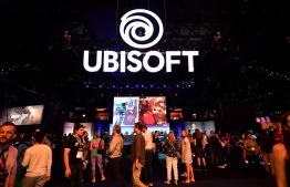 (FILES) In this file photo taken on June 11, 2019 gaming fans play Ubisoft games at the 2019 Electronic Entertainment Expo, also known as E3, opening in Los Angeles, California: Game sales have decreased since life is returning to somewhat pre-crisis normal levels, but they still appear to be above pre-pandemic levels  -- Photo: Frederic J. Brown / AFP