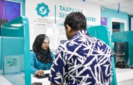 A customer seeks service Maldives Inland Revenue Authority (MIRA): The state received MVR 3.4 billion in taxes last month -- Photo: Fayaaz Moosa