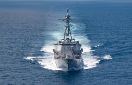 In this handout image courtesy of the US Navy taken on August 27, 2021 the AI Arleigh-burke class guided-missile destroyer USS Kidd (DDG 100) transits the Taiwan Strait during a routine transit. - Two US warships sailed through the Taiwan Strait on August 28, 2022, the American navy said, the first such transit since China staged unprecedented military drills around the island (Photo by US NAVY / AFP) / 