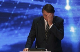 Brazilian President and re-election candidate Jair Bolsonaro (PL) gestures during the presidential debate ahead of the October 2 general election, at Bandeirantes television network in Sao Paulo, Brazil, on August 28, 2022. - Brazil's President Jair Bolsonaro faces his biggest rival for the presidency, popular leftist Luiz Inacio Lula da Silva, after days of uncertainty over whether they would participate. The debate is the first in the campaign calendar and organizers have also invited four other candidates, including former finance minister Ciro Gomes and Senator Simone Tebet. -- Photo: Miguel Schincariol / AFP