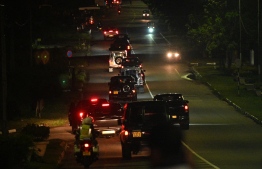 A convoy of vehicles said to be transporting former Sri Lankan President Gotabaya Rajapaksa convoy leaves Bandaranaike International Airport in Colombo early September 3, 2022. - Sri Lanka's deposed former president Gotabaya Rajapaksa returned to the country, an airport official said, seven weeks after he fled in the face of angry protests over the island's worst-ever economic crisis. (Photo by Ishara S. Kodikara / AFP)