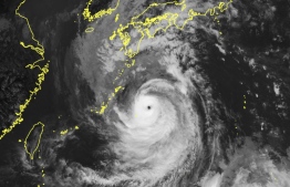 This handout photo taken and released on September 17, 2022 by the Japan Meteorological Agency shows satellite imagery shows Typhoon Nanmadol located near the southern remote islands of Japan. (Photo by Handout / Japan Meteorological Agency / AFP)