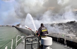 Coast Guard's second squadron in Male' area active at the site to douse the flames-- Photo: MNDF
