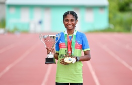 Jaisha with the "best Athlete" trophy and other medals won during the tournament -- photo: Nishan Ali