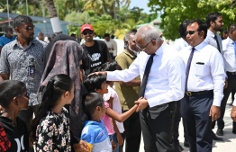 President Ibrahim Mohamed Solih greets children: The president urged the importance of instilling a sense of nationalism in children -- Photo: President's Office