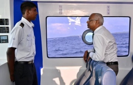 President experiences RTL ferry system. -- Photo: President's Office