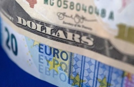 US dollars and Euro bills are pictured on September 6, 2022 in Brest, western France -- Photo: Fred Tanneau/ Afp