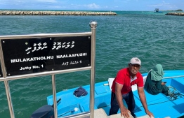 Mr. Yoosuf ensures his daughter reaches her place of work on time-- Photo: Mihaaru