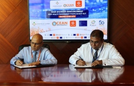 Tourism Minister Dr. Abdulla Mausoom and Dhiraagu CEO and MD Ismail Rasheed signing the partnership agreement. Photo: Dhiraagu