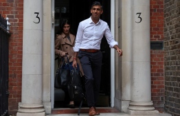 Britain's former Chancellor of the Exchequer, Conservative MP, Rishi Sunak leaves from an office in central London on October 23, 2022. - British Conservative Rishi Sunak on Sunday announced he is standing to be prime minister, just weeks after failing in a first attempt and setting up a potentially bruising battle with his former boss Boris Johnson. (Photo by ISABEL INFANTES / AFP)