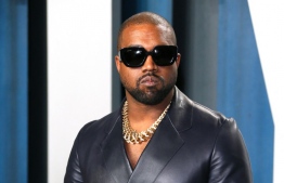 (FILES) In this file photo taken on February 10, 2020 Kanye West attends the 2020 Vanity Fair Oscar Party following the 92nd annual Oscars at The Wallis Annenberg Center for the Performing Arts in Beverly Hills: Adidas has terminated their collaboration with Kanye West following his anti-semetic remarks, a move that would slash Adidas' net income in 2022 by "up to 250 million euros (USD 246 million)" according to their estimates -- Photo by Jean-Baptiste Lacroix / AFP