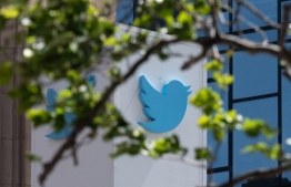 (FILES) In this file photo taken on April 26, 2022, the Twitter logo at their headquarters in downtown San Francisco, California. - Musk said on October 27, 2022, he is acquiring Twitter to enable "healthy" debate on a wide range of ideas and counter a trend in which social media splinters into partisan "echo chambers." The billionaire entrepreneur pursued the deal "because it is important to the future of civilization to have a common digital town square, where a wide range of beliefs can be debated in a healthy manner, without resorting to violence," Musk tweeted on the eve of a court-imposed deadline to finalize the $44 billion acquisition. -- Photo: Amy Osborne / AFP