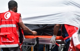Emergency Response team carrying the bodies of deceased victims out from the area-- Photo: Fayaz Moosa 