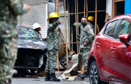 [FILE] MNDF officers at the scene of the fire: More than MVR 90,000 has been spent so far to help the victims