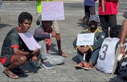 Local fishermen gathered at L. Maandhoo pier; protesting over payments overdue-- Photo: Mihaaru