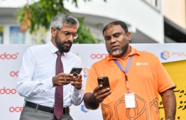 Ooredoo Maldives CEO Khalid Al-Hamadi (L) with FSM Managing Director Mohamed Hassan (R); launching m-Faisaa integration to FSM refueling stations at a special ceremony-- Photo: Fayaz Moosa | Mihaaru