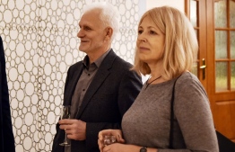 (FILES) This file photo taken on December 11, 2019 shows Belarusian human rights activist Ales Bialiatski (Beliatsky) and his wife Natalia Pinchuk attending a reception after he received the Franco-German Prize for Human Rights and the Rule of Law in Minsk. - Natalia Pinchuk, the wife of jailed Belarusian activist Ales Bialiatski, one of this year's Nobel Peace Prize winners, will accept the award on his behalf at the upcoming ceremony, organisers said on November 25, 2022. Bialiatski was jailed after large-scale demonstrations against the regime in 2020, when Belarus' authoritarian President Alexander Lukashenko claimed victory in elections the international community deemed fraudulent. (Photo by Sergei GAPON / AFP)