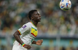 Senegal's defender #02 Formose Mendy eyes the ball during the Qatar 2022 World Cup Group A football match between Qatar and Senegal at the Al-Thumama Stadium in Doha on November 25, 2022. -- Photo: Odd Andersen / AFP