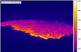 This webcam image released by the US Geological Survey (USGS) on November 28, 2022 courtesy of the National Weather Service, shows the lava in the summit caldera of Mauna Loa in Hawaii, which is erupting for the first time in nearly 40 years. - Hawaii's Mauna Loa, the largest active volcano in the world, has erupted for the first time in nearly 40 years, US authorities said, as emergency crews went on alert early Monday. -- Photo by Handout / US Geological Survey / AFP