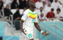 Senegal's forward #19 Famara Diedhiou celebrates scoring his team's second goal during the Qatar 2022 World Cup Group A football match between Qatar and Senegal at the Al-Thumama Stadium in Doha on November 25, 2022. -- Photo: Karim Jaafar / AFP