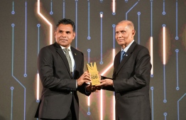 Vice President Faisal Naseem presenting the Lifetime Achievement Award to Mohamed Salih, Chairman of Damas company -- Photo: Fayaaz Moosa