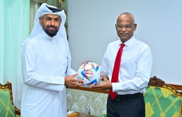 The CEO of Ooredoo Maldives Khalid Hassan Al-Hamadi (L) meeting President Ibrahim Mohamed Solih (R) at the President's Office on May 12, 2022, to present an Adidas Al-Rihla, the official match ball for the tournament to the President. PHOTO: President's Office