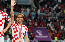 މޮޑްރިޗް ވޯލްޑް ކަޕްގެ ބްރޯންޒް މެޑެލް އާއެކު.-- ފޮޓޯ: އޭއެފްޕީ