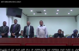 Yameen with three of his lawyers at the sentence hearing in the Aarah case