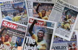 An arrangement of UK daily newspaper front pages photographed as an illustration in London on December 30, 2022, shows headlines reporting on the death of Brazilian football legend Pele, who died on December 29, 2022. - Pele passed away aged 82 after suffering "multiple organ failure" following a long battle with cancer and football's current and former stars were quick to salute arguably the sport's greatest ever player. -- Photo: Isabel Infantes / AFP
