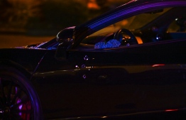 Bullet holes and broken glass are seen on a car being towed from the restaurant "The Licking" where a shooting investigation is being held in Miami Gardens, Florida, Miami, on January 5, 2023. - Multiple people were shot Thursday night outside of a Miami Gardens restaurant during a video shoot for rappers French Montana and Rob49. -- Photo: Chandan Khanna / AFP