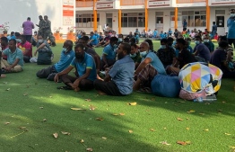 Employees of Male' City Council at Imaduddin School. Those living at the accommodation block adjacent to Neelan Fihaara were evacuated as the fire broke out.