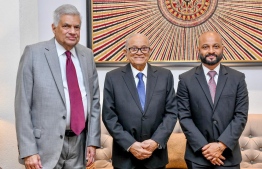 President Maumoon Abdul Gayoom (M) and his son Faris Maumoon (R) with Sri Lankan President Ranil Wickremesinghe (L)--