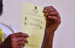 A vote card being showcased after the voting period is over, and votes are being counted. The vote card shows a tick indicating the vote was cast to the first candidate, President Ibrahim Mohamed Solih -- Photo: Fayaz Moosa / Mihaaru