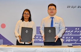 The Ministry of Environment, Climate Change and Technology signed with China's Sinosoar Ying Li Consortium to install Solar-PV systems in two atolls-- Photo: Environment Ministry