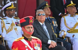 Sri Lanka's Presid ent Ranil Wickremesinghe (C) watches Sri Lankan Army soldiers parade during Sri Lanka's 75th Independence Day celebrations in Colombo on February 4, 2023. -- Photo: Ishara S. Kodikara / AFP