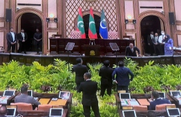 Opposition lawmakers approaching the Speaker's podium at the first session of the parliament of this year on 6th February 2023. MIHAARU PHOTO