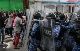 Police in rioting gear controlling the crowd gathered in protest of the presidential address given by President Ibrahim Mohamed Solih on Monday, February 7, 2023: MBC has called for journalists' safety as two journalists covering the protest yesterday were injured -- Photo:  Fayaz Moosa / Mihaaru